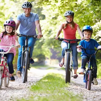 Family On Cycle Ride In Countryside